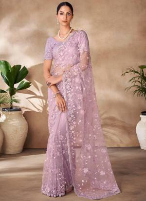 Looking These Party Wear Saree in Fine Colored.These Saree Are Net And Blouse is Fabricated On Net Pair.Its Beautified With Designer Heavy Thread,Sequance Embroidery,Zarkan Work.