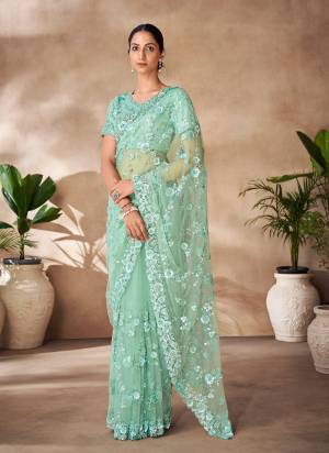 Looking These Party Wear Saree in Fine Colored.These Saree Are Net And Blouse is Fabricated On Net Pair.Its Beautified With Designer Heavy Thread,Sequance Embroidery,Zarkan Work.