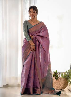 Garb These Party Wear Saree in Fine Colored.These Saree And Blouse is Fabricated On Kanjivaram Silk.Its Beautified With Weavon Copper Jari Designer.