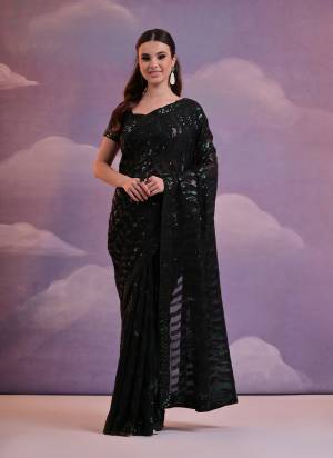 Garb These Party Wear Saree in Fine Colored.These Saree Are Georgette And Blouse is Mono Banglori Fabricated.Its Beautified With Designer Laheriya Style Sequance Embroidery Work.