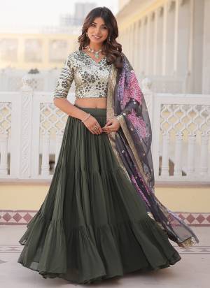 For A Designer Look,Grab These Lehenga Choli in Fine Dusty Colored.These Lehenga And Blouse Are Fabricated On Faux Georgette Pair With Russion Silk Dupatta.Its Beautified With Designer Heavy Sequance Embroidery Work,Printed Dupatta.