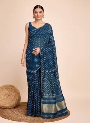 Garb This Partywear Saree Paired With Blouse.This Saree And Blouse Are Handloom Faux Cotton Fabric With Weaving Jari Designer With Bandhani Printed. Buy This Pretty Saree Now.