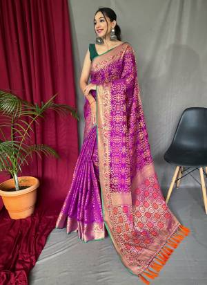 Attrective This Partywear Saree Paired With Blouse.This Saree And Blouse Are Patola Silk Based Fabric With Weaving Jacquard Jari Designer. Buy This Pretty Saree Now.