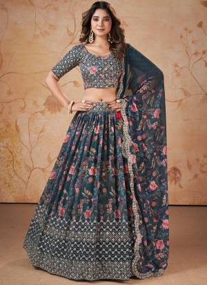 For A Designer Look,Grab These Lehenga Choli in Fine Colored.These Lehenga And Blouse Are Fabricated On Faux Georgette Pair With Faux Georgette Dupatta.Its Beautified With Digital Printed,Jari, Sequance Embroidery Work.