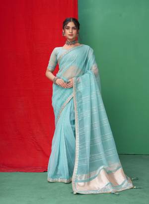 Looking These Party Wear Saree in Fine Colored.These Saree Are Organza And Blouse is Fabricated On Organza.Its Beautified With Wevon Lining Designer With Coding,Sequance,Gota Patti Embroidery Work.