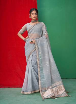 Looking These Party Wear Saree in Fine Colored.These Saree Are Organza And Blouse is Fabricated On Organza.Its Beautified With Wevon Lining Designer With Coding,Sequance,Gota Patti Embroidery Work.