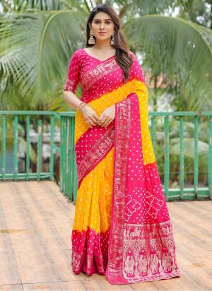 Garb These Festive Wear Saree in Fine Colored.These Saree And Blouse is Fabricated On Dola Silk.Its Beautified With Wevon Border Pallu Designer With Bandhj Handmade Printed.