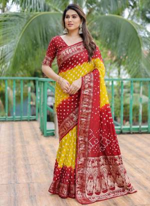 Garb These Festive Wear Saree in Fine Colored.These Saree And Blouse is Fabricated On Dola Silk.Its Beautified With Wevon Border Pallu Designer With Bandhj Handmade Printed.