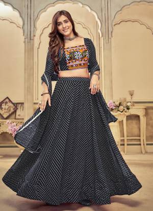 Grab These Navratri Special Lehenga Choli in Fine Colored.These Lehenga Are Georgette Choli Are Georgette And Dupatta Are Fabricated On Georgette Pair.Its Beautified With Designer Thread,Mirror Embroidery Work.