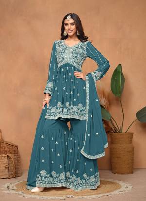 Garb These Party Wear Sharara Suit in Fine Colored Pair With Bottom And Dupatta.These Top And Dupatta Are Fabricated On Faux Georgette Pair With Faux Georgette Bottom.Its Beautified With Santoon Inner.Its Beautified With Designer Heavy Embroidery Work.