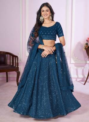 For A Designer Look,Grab These Lehenga Choli in Fine Colored.These Lehenga And Choli Are Fabricated On Georgette Pair With Soft Net Dupatta.Its Beautified With Designer Sequance,Thread Embroidery Work.