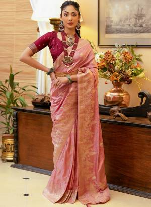 Take This Ethno Rich Satin Silk Fabric Saree With A Smooth, Lustrous Finish Intricate Zari Weaving That Adds A Touch Of Embossed Sophistication. This Classic Masterpiece Is Musthave For The Indian Wardrobe