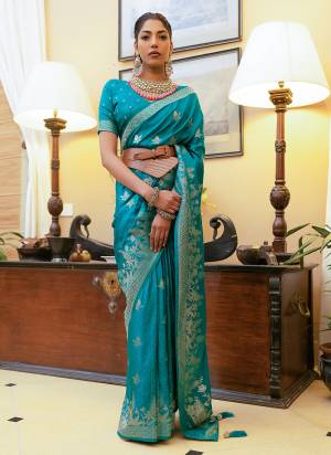 Take This Ethno Rich Satin Silk Fabric Saree With A Smooth, Lustrous Finish Intricate Zari Weaving That Adds A Touch Of Embossed Sophistication. This Classic Masterpiece Is Musthave For The Indian Wardrobe