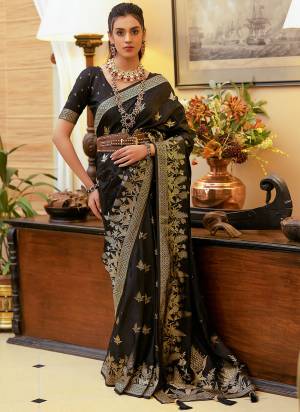 Take This Ethno Rich Satin Silk Fabric Saree With A Smooth, Lustrous Finish Intricate Zari Weaving That Adds A Touch Of Embossed Sophistication. This Classic Masterpiece Is Musthave For The Indian Wardrobe