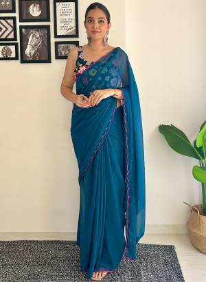 Grab This Beautiful Rama Colour Solid Color Saree With Fancy Arco Border Work And Heavy Embroidery Sequins Work Blouse Fabricated On Faux Georgette Fabric For Elegant Party Looks. Have This Bollywood Style Saree For Glamorous Feels