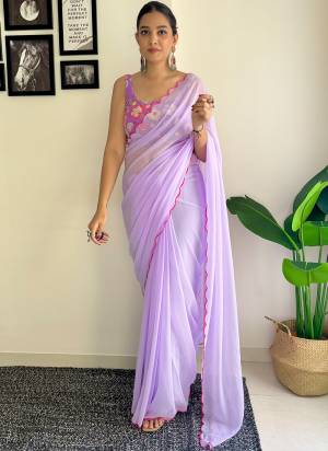 Grab This Beautiful Purple Colour Solid Color Saree With Fancy Arco Border Work And Heavy Embroidery Sequins Work Blouse Fabricated On Faux Georgette Fabric For Elegant Party Looks. Have This Bollywood Style Saree For Glamorous Feels