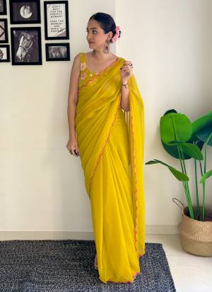 Grab This Beautiful Mustard Colour Solid Color Saree With Fancy Arco Border Work And Heavy Embroidery Sequins Work Blouse Fabricated On Faux Georgette Fabric For Elegant Party Looks. Have This Bollywood Style Saree For Glamorous Feels