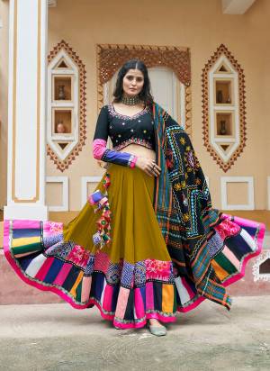 Grab This Beautifully Designed Chaniya Choli For The Coming Navratri Festive Season. This Flouracent Green Colour Traditional Lehenga And Blouse Is Crafted On Viscose Rayon Fabric With Cotton Fabric Dupatta. This Pair Of Lehenga Choli Is Gracefully Designer With Ethnic Prints, Thread Embroidery With Mirror Work.