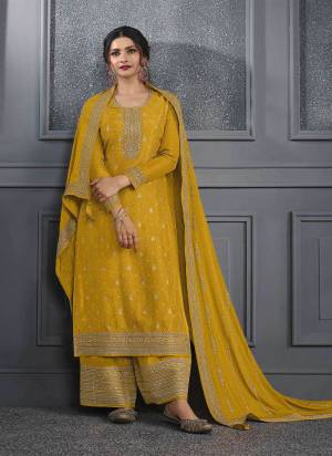 Yellow colored Salwar suit is prettified with Embroidery work , Sequence Work and Diamond Work as shown which makes it appear classy. This top is made of Dola Silk fabric which is accompanied with Santoon bottom and Georgette dupatta. Women can buy this suit to wear for their parties and functions.