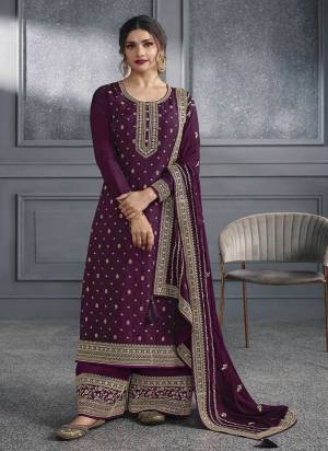 Purple colored Salwar suit is prettified with Embroidery work , Sequence Work and Diamond Work as shown which makes it appear classy. This top is made of Dola Silk fabric which is accompanied with Santoon bottom and Georgette dupatta. Women can buy this suit to wear for their parties and functions.