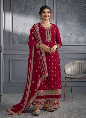 Red colored Salwar suit is prettified with Embroidery work , Sequence Work and Diamond Work as shown which makes it appear classy. This top is made of Dola Silk fabric which is accompanied with Santoon bottom and Georgette dupatta. Women can buy this suit to wear for their parties and functions.