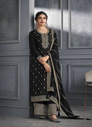 Black colored Salwar suit is prettified with Embroidery work , Sequence Work and Diamond Work as shown which makes it appear classy. This top is made of Dola Silk fabric which is accompanied with Santoon bottom and Georgette dupatta. Women can buy this suit to wear for their parties and functions.