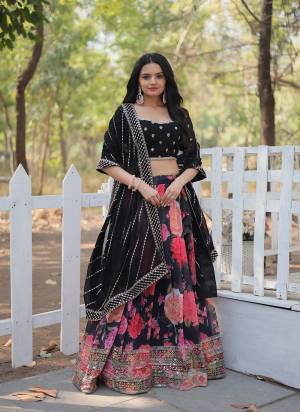 Introducing our Exquisite Collection of Digital Printed Georgette Lehengas, Each Lehenga is A Masterpiece, Crafted to Perfection and Adorned With delicate tassels. It Is Beautified With Floral Printed Lehenga With Heavy Sequins & Thread Embroidered Work