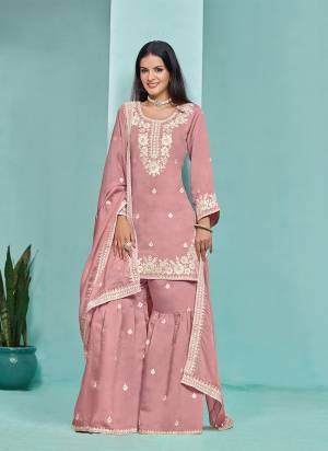 Garb These Party Wear Sharara Suit in Fine Colored Pair With Bottom And Dupatta.These Top And Bottom Are Fabricated On Roman Silk Pair With Organza Dupatta.Its Beautified With Santoon Inner.Its Beautified With Designer Heavy Embroidery Work.