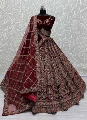 For A Fancy Designer Look,Grab These Lehenga Choli With 2 Dupatta in Fine Colored.These Lehenga And Choli Are Velvet And Dupatta Are Fabricated On Soft Net & Velvet Pair.Its Beautified With Designer Hand Mirror,Sequance,Thread,Dori,Jari Embroidery With Diamond Work.