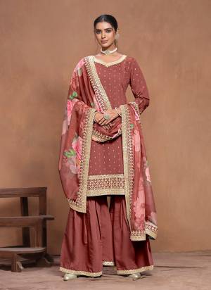 Garb These Party Wear Plazzo Suit in Fine Colored Pair With Bottom And Dupatta.These Top And Bottom Are Fabricated On Roman Silk Pair With Organza Dupatta.Its Beautified With Santoon Inner.Its Beautified With Designer Embroidery Work With Printed Dupatta.