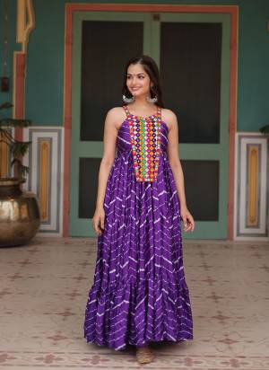 Attrective Looking These Beautiful Looking Readymade Long Gown.These Gown is Fabricated On Chinon.Its Beautified With Laheriya Printed With Kutchi Patch Work.