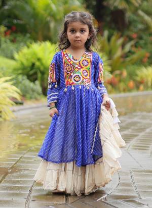 Grab These Navratri special Adult And Kids Lehenga Kurti in Fine Colored. These Lehenga Are Kora Cotton And Kurti Are Fabricated On Georgette Fabric. It is Beautified With Designer Printed With Traditional (Gamthi) Thread Work. Grace This Garba Season With This Beautiful Gamthi Work Attire.