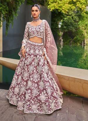 Attrective Looking This Partywear Fine Color Fancy Heavy Designer Choli And Lahenga Fabriced On Satin And Dupatta Net In Fabricated Beautified With Attrective Designer Heavy Embroidery Work. Buy Now.