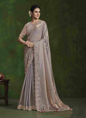 Garb These Party Wear Saree in Fine Colored.These Saree  Is 2 Tone Satin Silk And Blouse is Satin Silk.Its Beautified With Dual Sequence with Diamond Work.