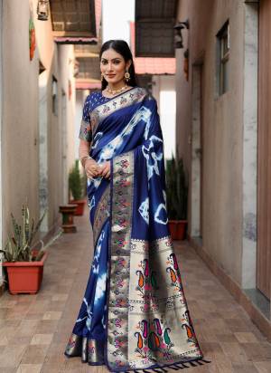 Garb These Festive Wear Saree in Fine Colored.These Saree And Blouse is Fabricated On Paithani Silk.Its Beautified With Wevon Border Pallu Designer With Saburi Printed.