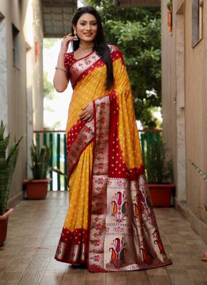 Garb These Festive Wear Saree in Fine Colored.These Saree And Blouse is Fabricated On Dola Silk.Its Beautified With Wevon Border Pallu Paithani Designer With Bandhej Printed.