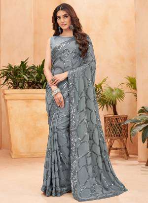 Looking These Fastival Wear Saree in Fine Colored.These Saree Are Faux Georgette And Blouse is Fabricated On Mulburry Silk.Its Beautified With Blooming Color With Heavy Designer Sequance Embroidery Work.