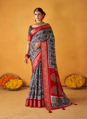 Garb These Party Wear Saree in Fine Colored.These Saree And Blouse is Fabricated On Tussar Silk Pair.Its Beautified With Wevon Designer With Batik Printed.