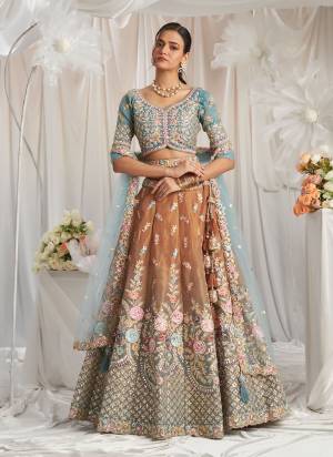 Attrective Looking This Partywear Fine Color Fancy Heavy Designer Choli And Lahenga Fabriced On Tissue And Dupatta Net In Fabricated Beautified With Attrective Designer Heavy Embroidery Work. Buy Now.