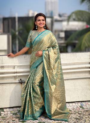 Attrective These Party Wear Saree in Fine Colored.These Saree And Blouse is Fabricated On Jari Tissue.Its Beautified With Weaving Jacquard Laheriya Designer.