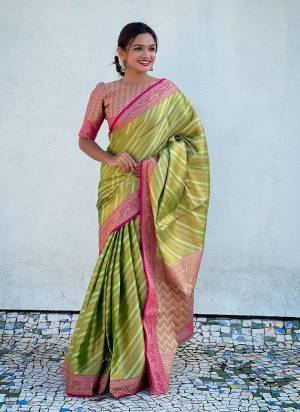 Attrective These Party Wear Saree in Fine Colored.These Saree And Blouse is Fabricated On Jari Tissue.Its Beautified With Weaving Jacquard Laheriya Designer.