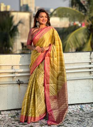 Attrective These Party Wear Saree in Fine Colored.These Saree And Blouse is Fabricated On Jari Tissue.Its Beautified With Weaving Jacquard Laheriya Designer.