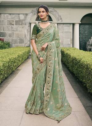 Attrective This Partywear Saree Paired With Blouse.This Saree Are Viscose Tissue And Blouse Are Viscose Tissue Based Fabric With Weaving Jari Designer With Embroidery Work. Buy This Pretty Saree Now.