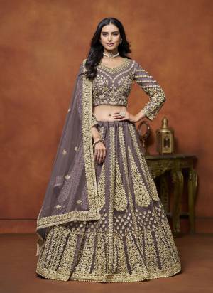 For A Designer Look,Grab These Lehenga Choli in Fine Colored.These Lehenga And Blouse Are Fabricated On Net Pair With Net Dupatta.Its Beautified With Designer Embroidery Work.