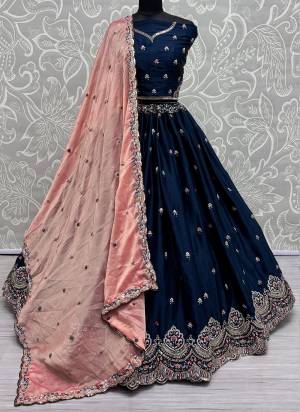 For A Fancy Designer Look,Grab These Lehenga Choli With Dupatta in Fine Colored.These Lehenga And Choli Are Silk And Dupatta Are Fabricated On Chinon Pair.Its Beautified With Designer Double Sequance,Thread Embroidery Work.