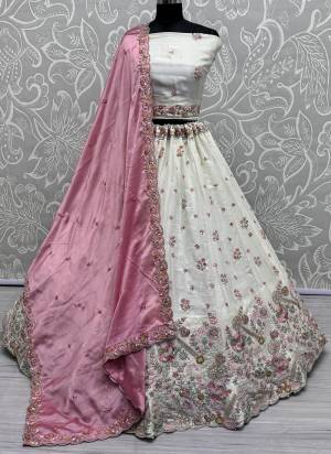 For A Fancy Designer Look,Grab These Lehenga Choli With Dupatta in Fine Colored.These Lehenga And Choli Are Silk And Dupatta Are Fabricated On Chinon Pair.Its Beautified With Designer Double Sequance,Thread Embroidery Work.