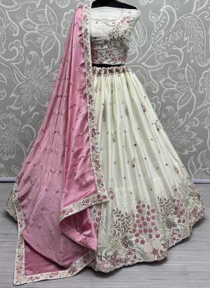 For A Fancy Designer Look,Grab These Lehenga Choli With Dupatta in Fine Colored.These Lehenga And Choli Are Silk And Dupatta Are Fabricated On Chinon Pair.Its Beautified With Designer Double Sequance,Thread Embroidery Work.