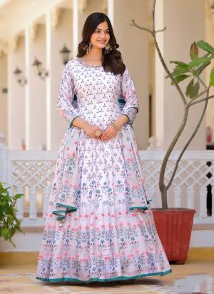 Garb These Designer Gown in Fine Colored Pair With Dupatta.These Gown Are Fabricated On Dola Silk Pair With Chinon Dupatta.Its Beautified With Designer Digital Printed With Hand Work.