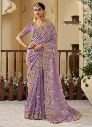 Attrective This Partywear Saree Paired With Blouse.This Saree Are Viscose Organza And Blouse Are Viscose Tissue Based Fabric With Weaving Jari Designer With Embroidery Work. Buy This Pretty Saree Now.