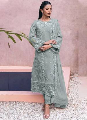 Looking These Designer Suit in Fine Colored Pair With Bottom And Dupatta.These Top Are Georgette And Dupatta Are Fabricated On Nazmin Pair With Santoon Bottom.Its Beautified With Santoon Inner.Its Beautified With Heavy Designer Embroidery Work.